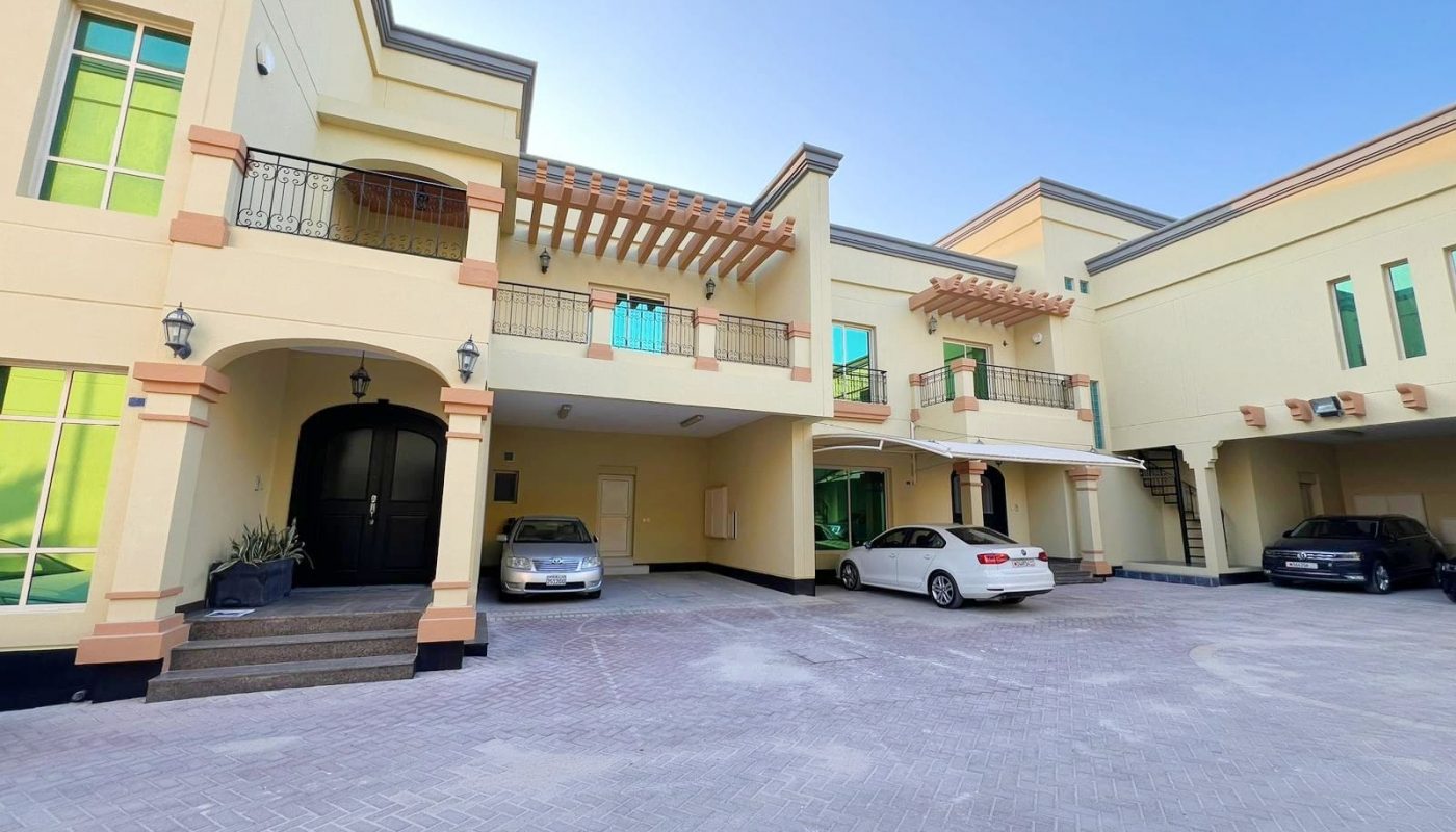 A house with two cars parked in front of it, perfect for those in need of SEO keywords or an Auto Draft.