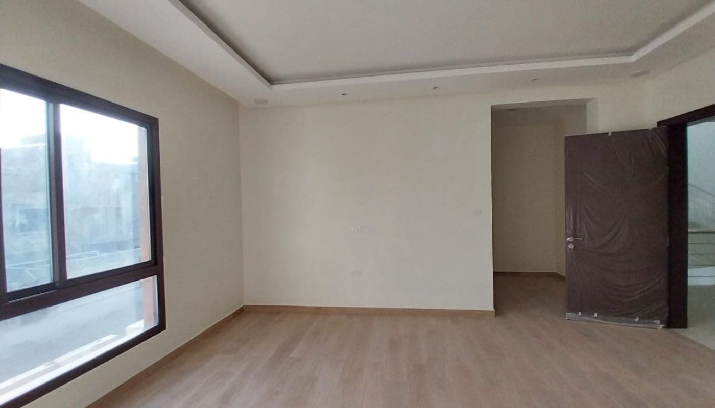 An amazing villa for sale with large windows and wooden floors.