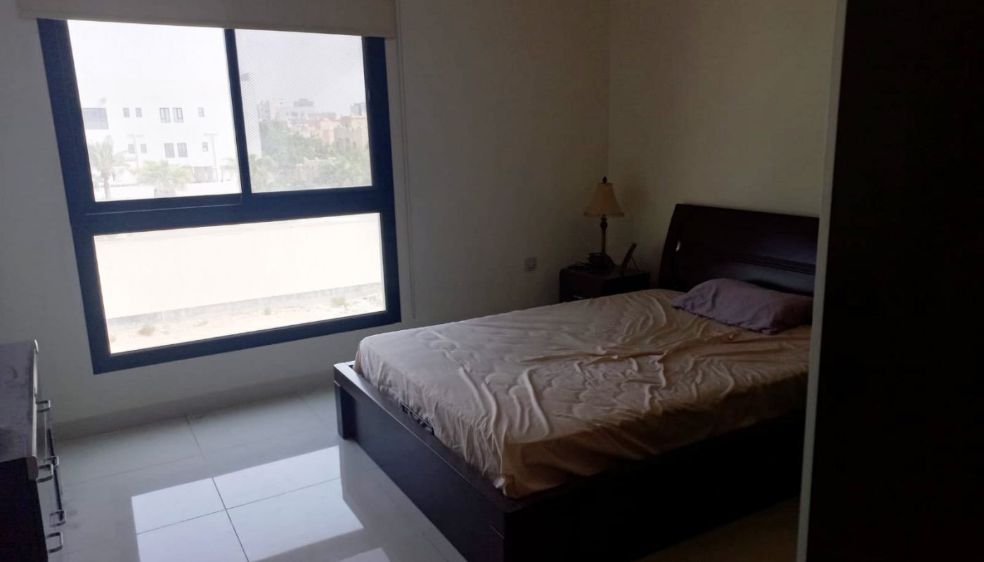 A luxury bedroom with a bed and a window.