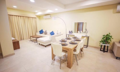 Amazing 2BR Apartments for Sale in Daih featuring a living room with a dining table and chairs.