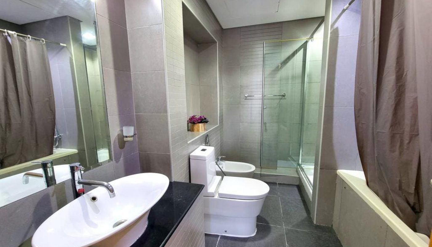 Immaculate bathroom with sink, toilet, and shower.