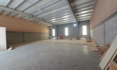 Spacious warehouse with construction materials.