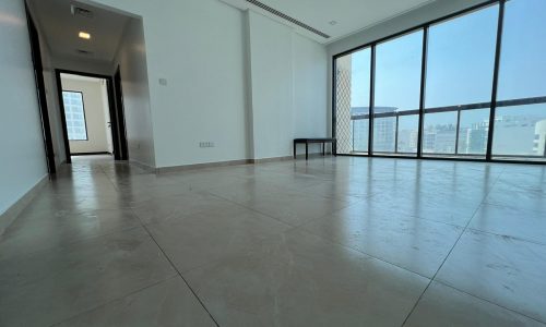 A luxurious apartment with large windows offering a breathtaking view of the city.