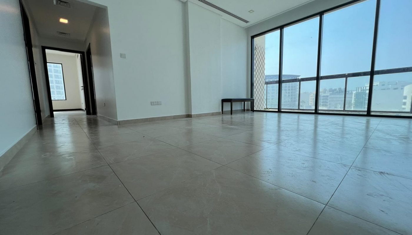 A luxurious apartment with large windows offering a breathtaking view of the city.