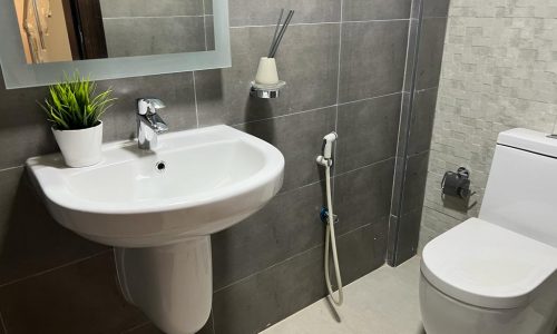 A small bathroom with a sink.