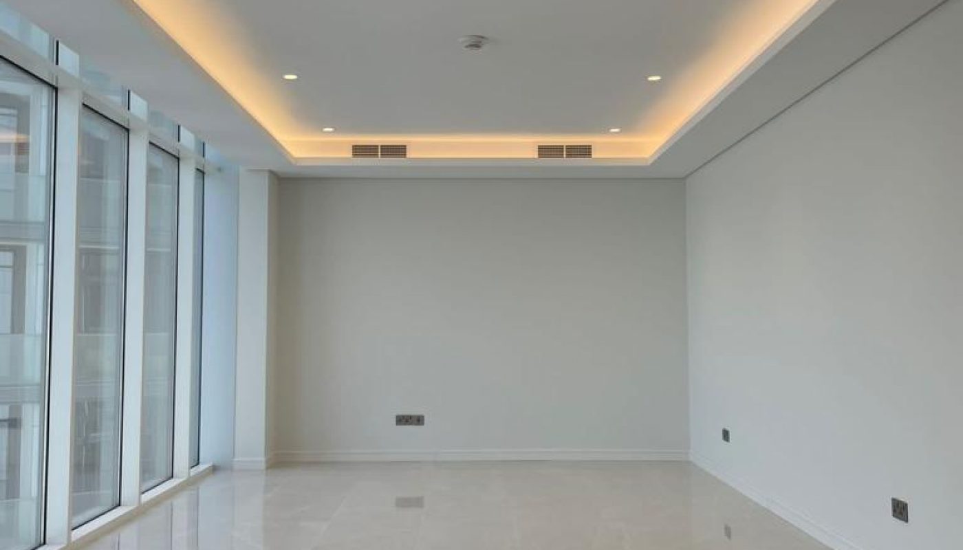 An expansive apartment with breathtaking sea views showcased through the large windows and complemented by abundant natural light fixtures.