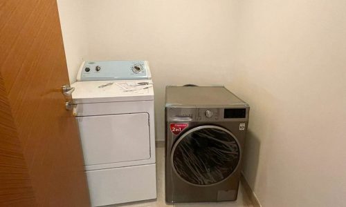 A small room in a stunning apartment for rent in Busaiteen with a washer and dryer.