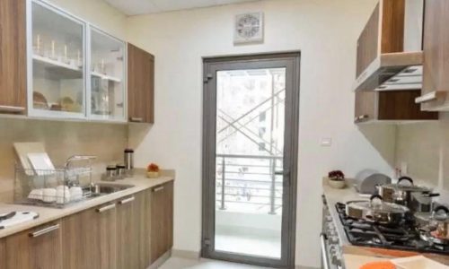 Luxury kitchen with wooden cabinets in SF 3BR Apartment.