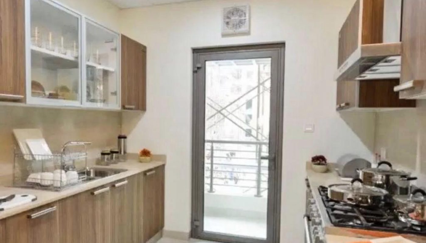 Luxury kitchen with wooden cabinets in SF 3BR Apartment.