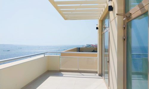 Rent an apartment with a breathtaking sea view from the balcony's glass doors.