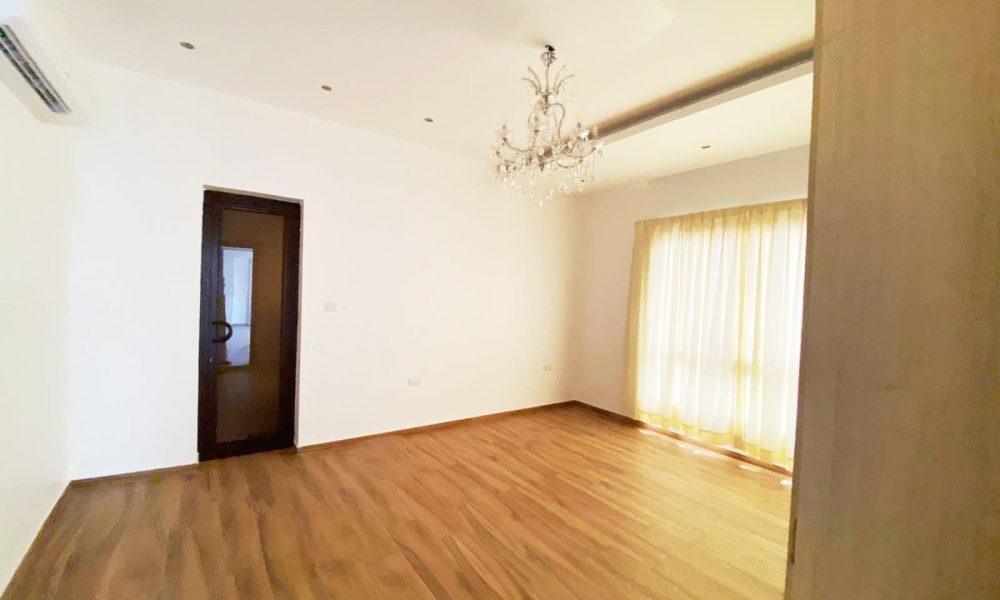 Luxury villa for sale with hardwood floors and chandelier in Al Markh.