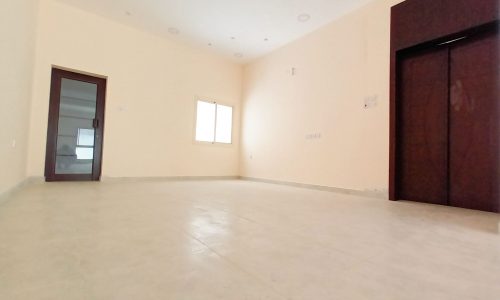 A room with a door in an amazing 3BR villa for sale.