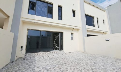 A distinguished villa in Malkiya with a door open.