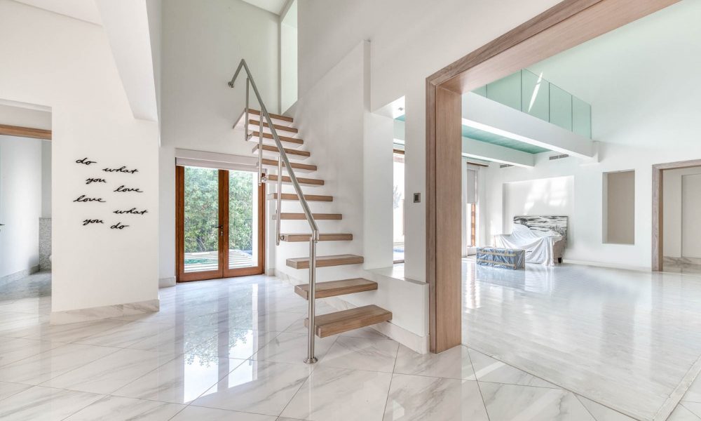 Stunning white house with a glass door.