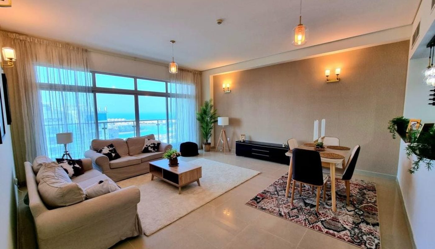 Immaculate living room with ocean view in 2BR Apartment for Sale in Amwaj Island.