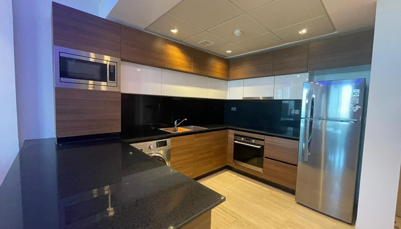 Sale: A kitchen with a black counter top and stainless steel appliances is available for sale.
Elegant: The elegant kitchen features a black counter top and stainless steel appliances.