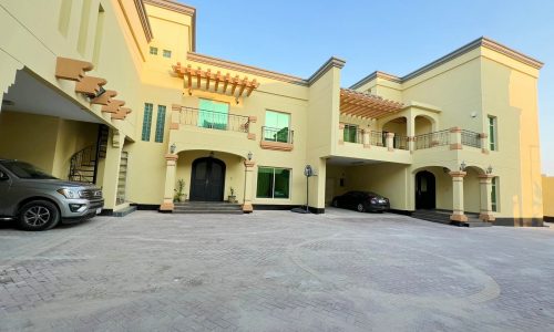 A house with an Auto Draft parked in front of it.