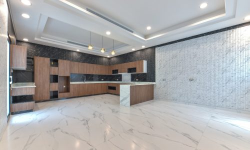 A 3D rendering of a kitchen with marble floors in a fancy villa for sale.