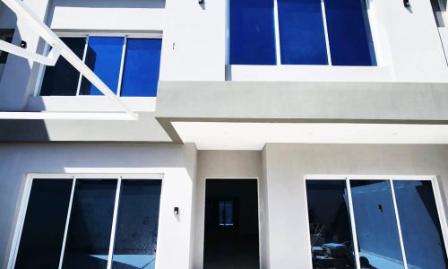 Luxury Villa with blue windows and a blue door for Sale in Bani Jamra | 1 Road.