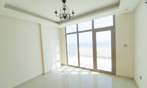 A stunning apartment for rent in Diyar Al Muharraq with sliding glass doors offering an incredible sea view.