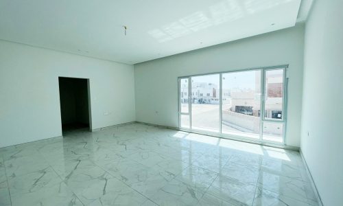 An amazing villa in Durrat Al Muharraq with marble floors and a sliding glass door.