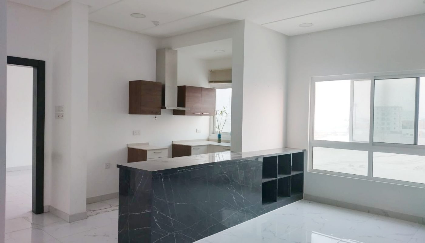 A room with a counter and a window for Auto Draft.