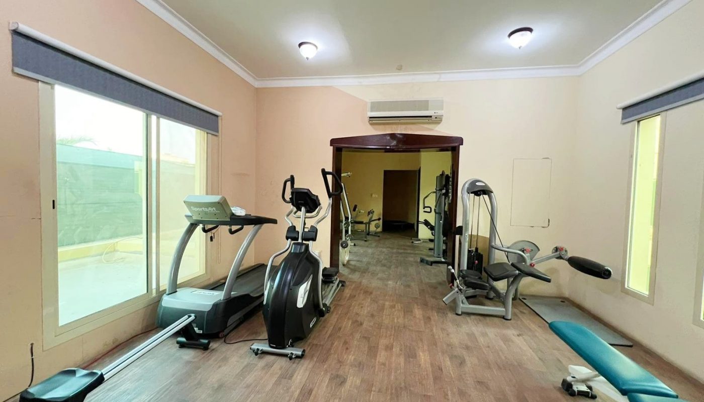 An Auto Draft gym room with a treadmill and other exercise equipment.