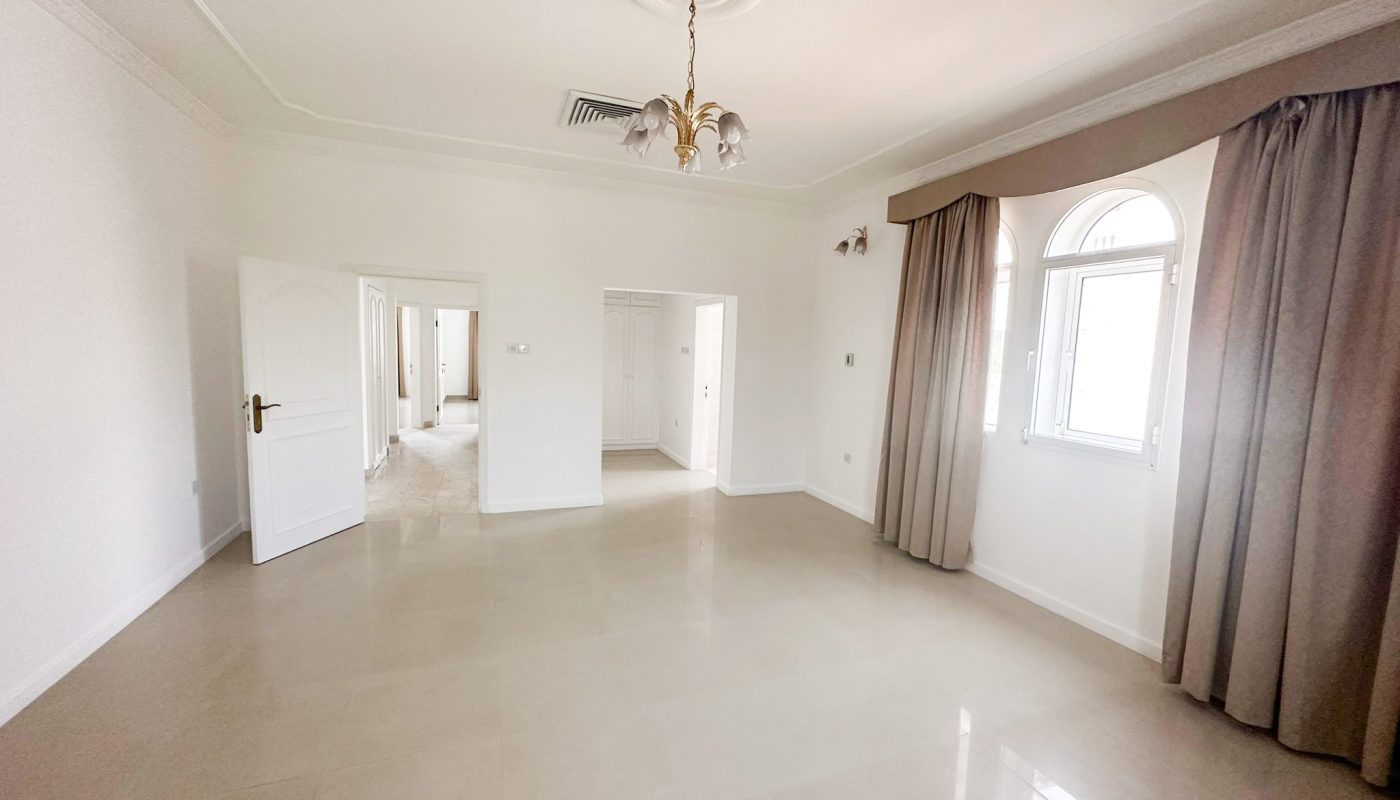A vacant villa with white walls and beige floors available for rent.
