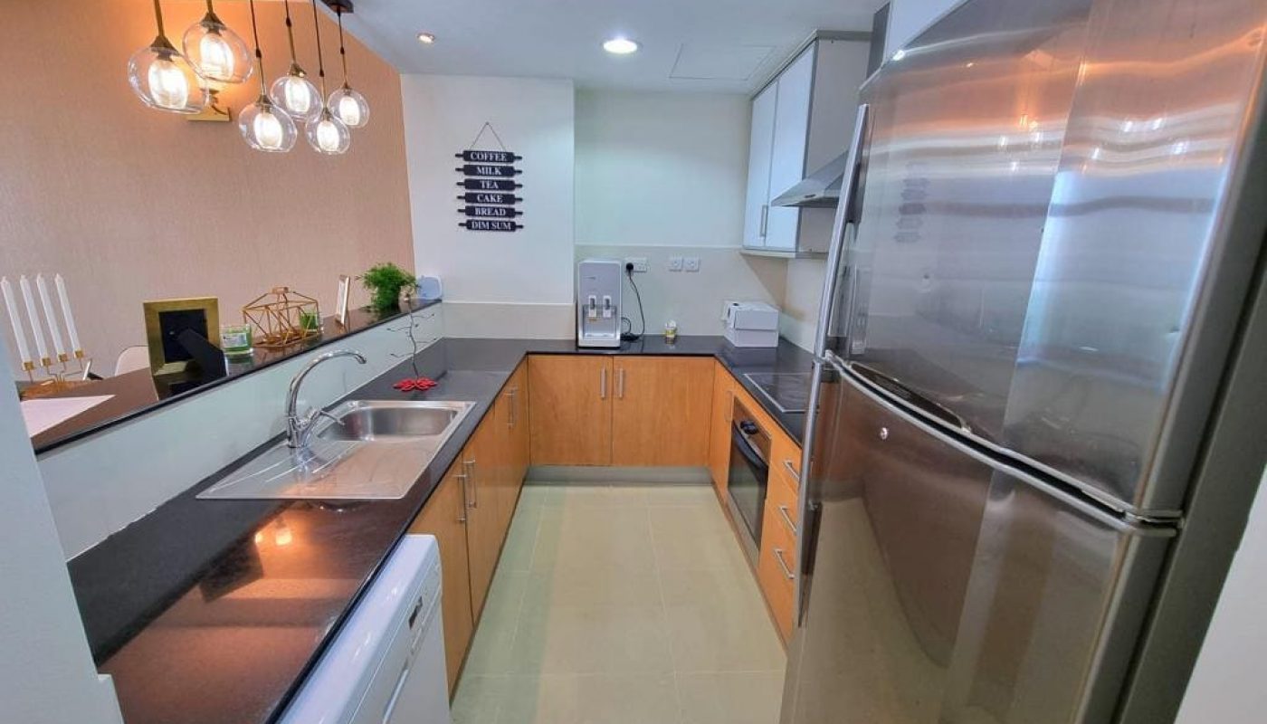 Immaculate 2BR Apartment for Sale in Amwaj Island with a kitchen or kitchenette featuring stainless steel appliances.