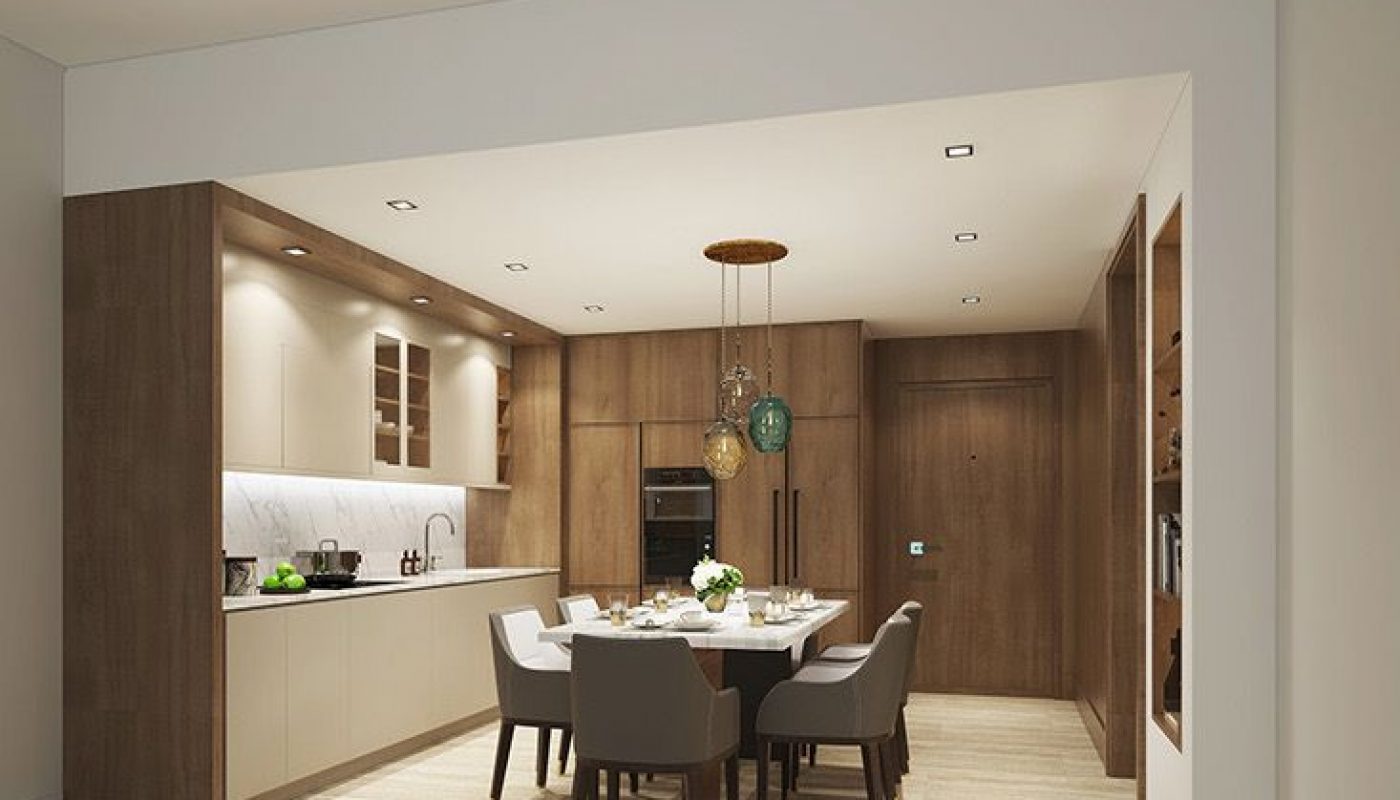 Modern kitchen and dining area with wooden cabinetry, a white countertop, built-in appliances, a dining table set for six, and pendant lights hanging above the table.