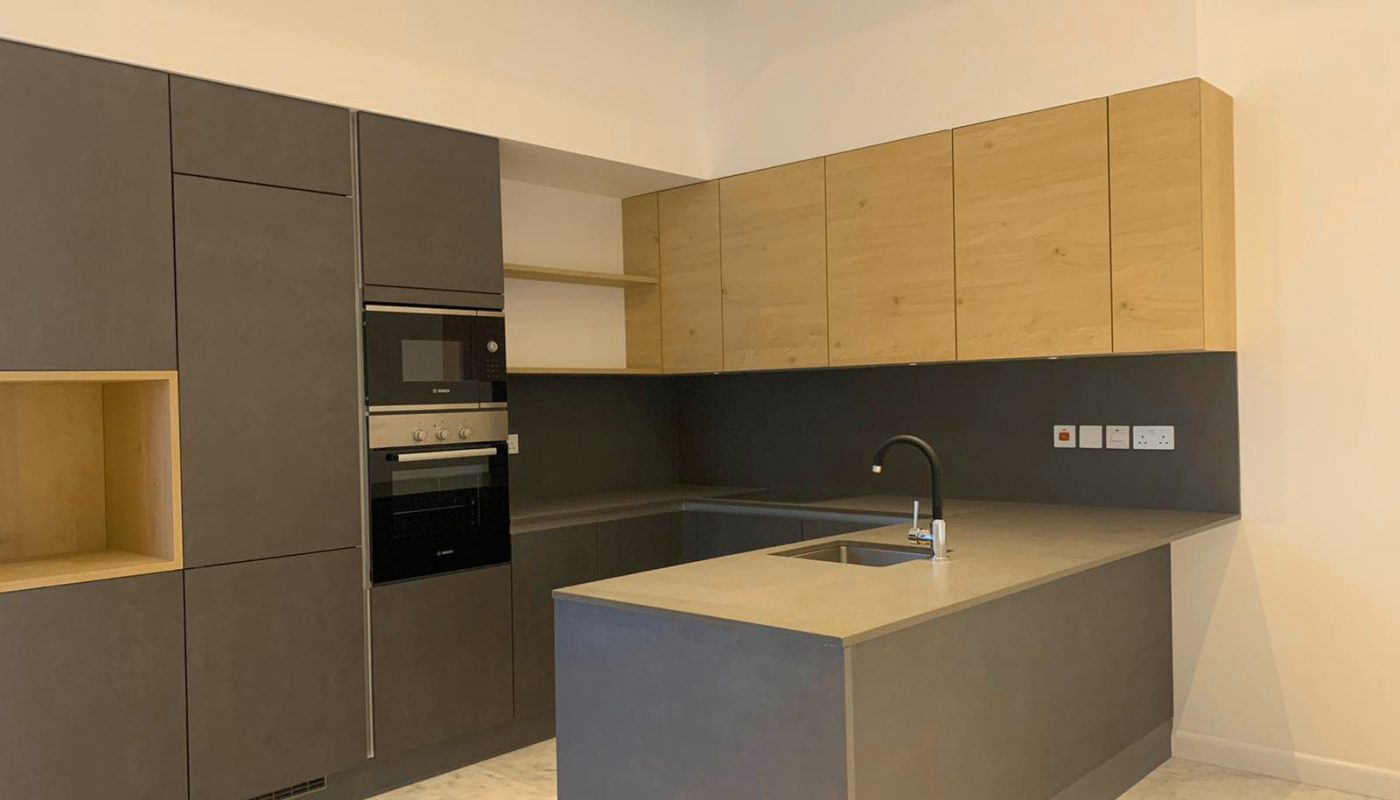 An eye-catching kitchen with a sink and a microwave.