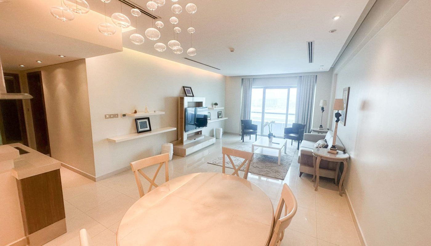A luxury apartment with a modern dining table and chairs.