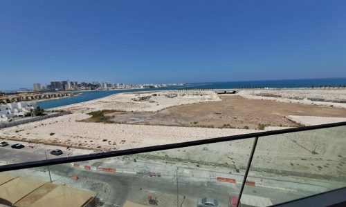 A view from the balcony of a Dilmunia Island apartment overlooking the ocean.