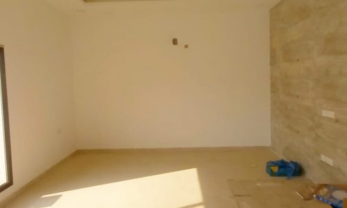 A spacious villa in Bani Jamra with a sliding glass door, currently available for sale.