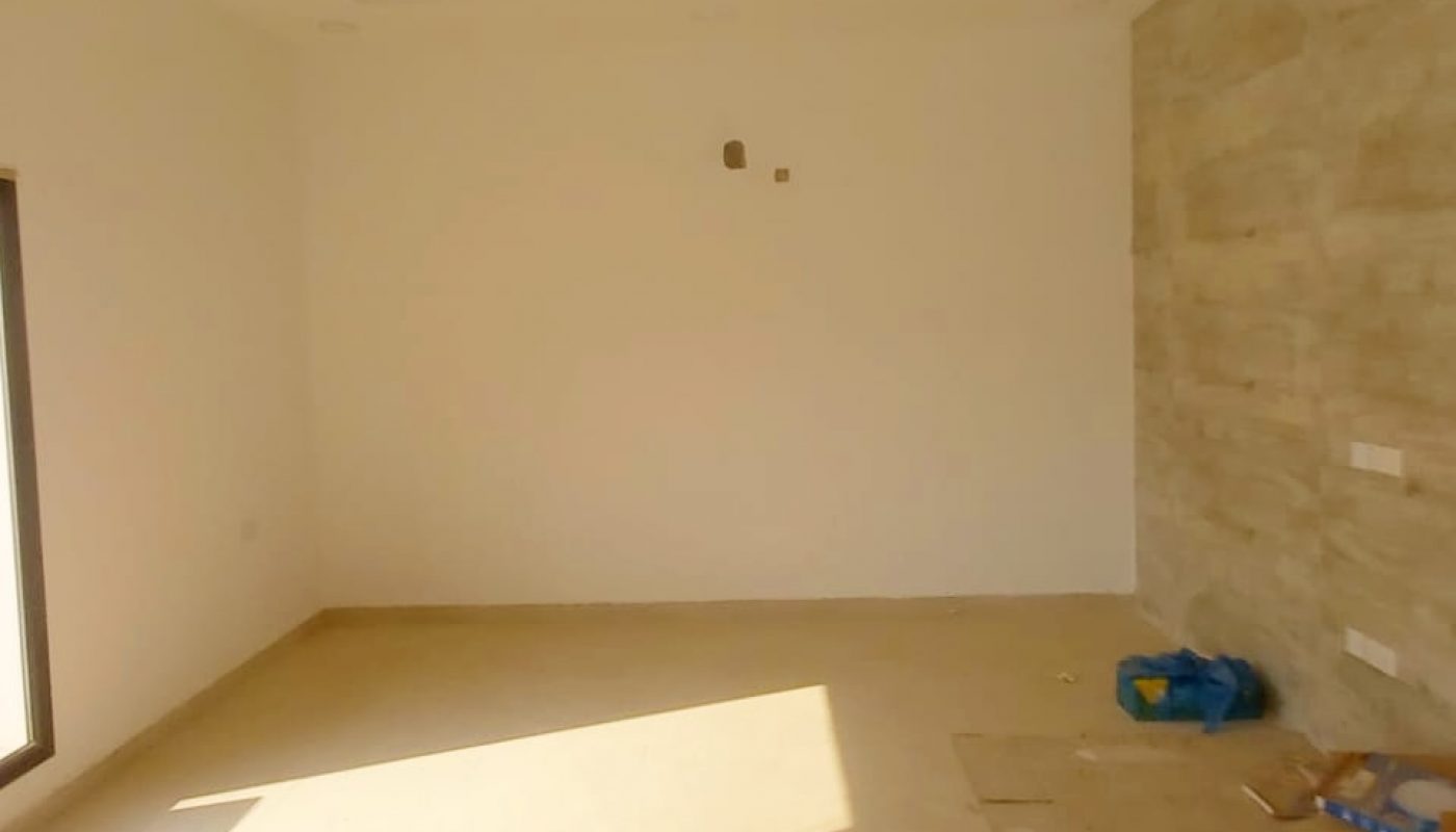 A spacious villa in Bani Jamra with a sliding glass door, currently available for sale.