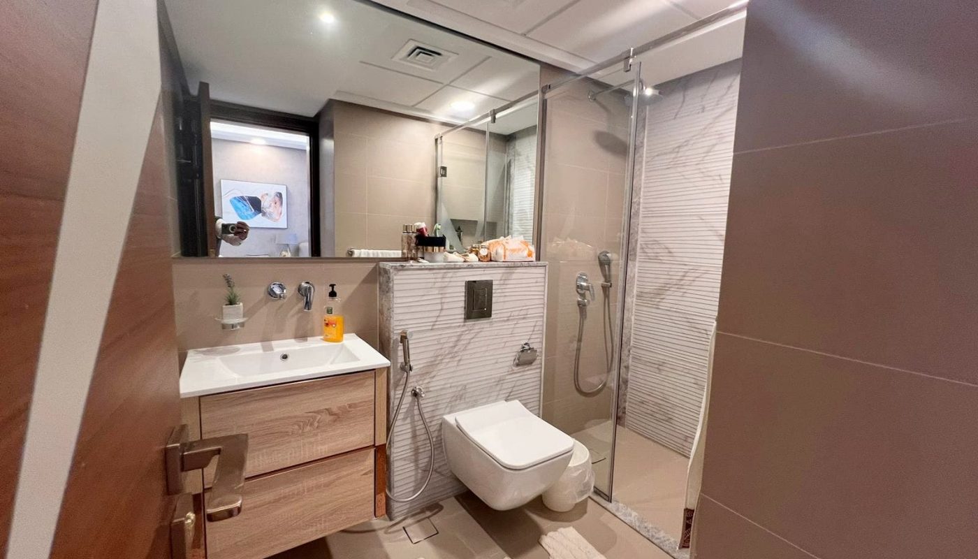 A luxurious bathroom with a toilet, sink and shower.