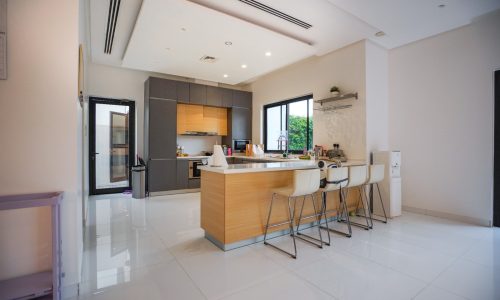 A modern kitchen with stainless steel appliances.