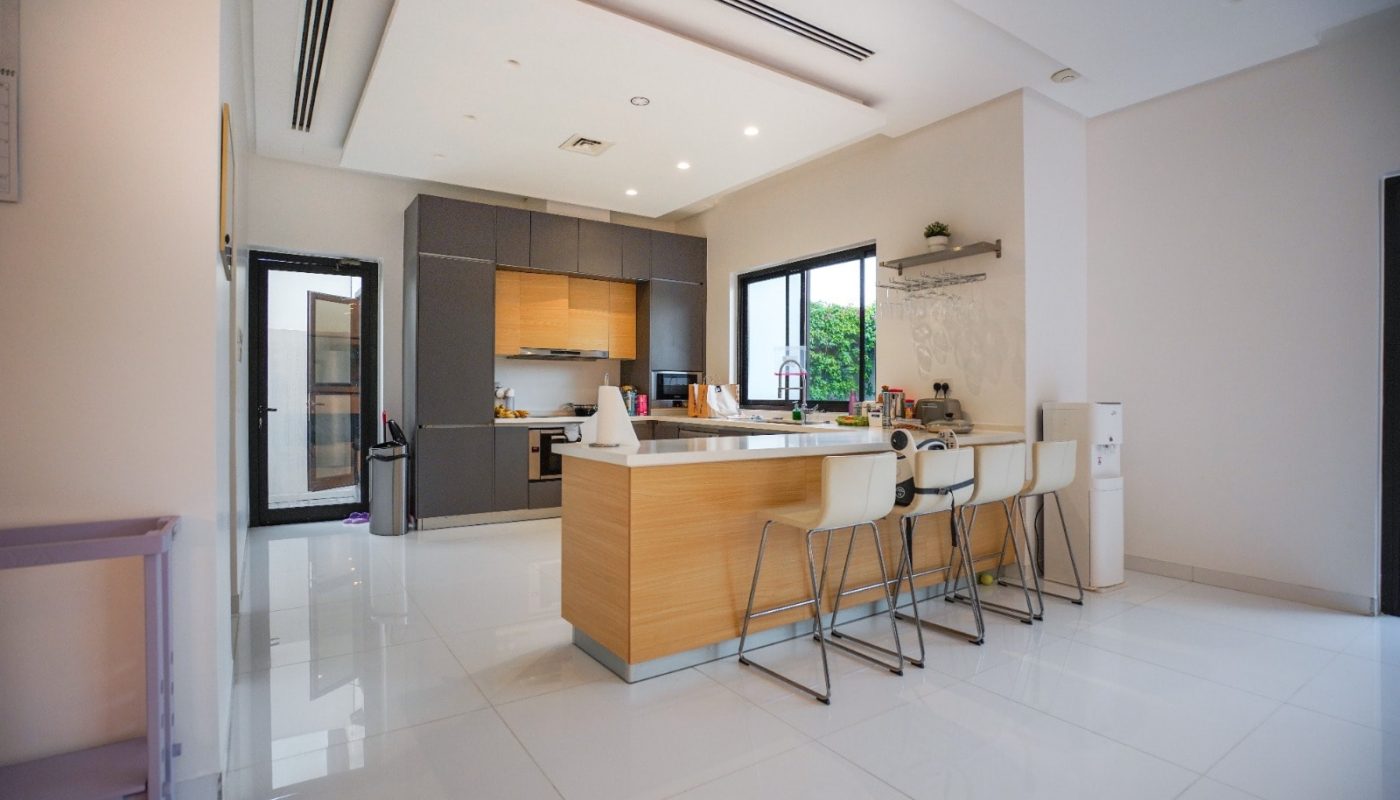 A modern kitchen with stainless steel appliances.