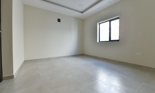 An empty room with a window.