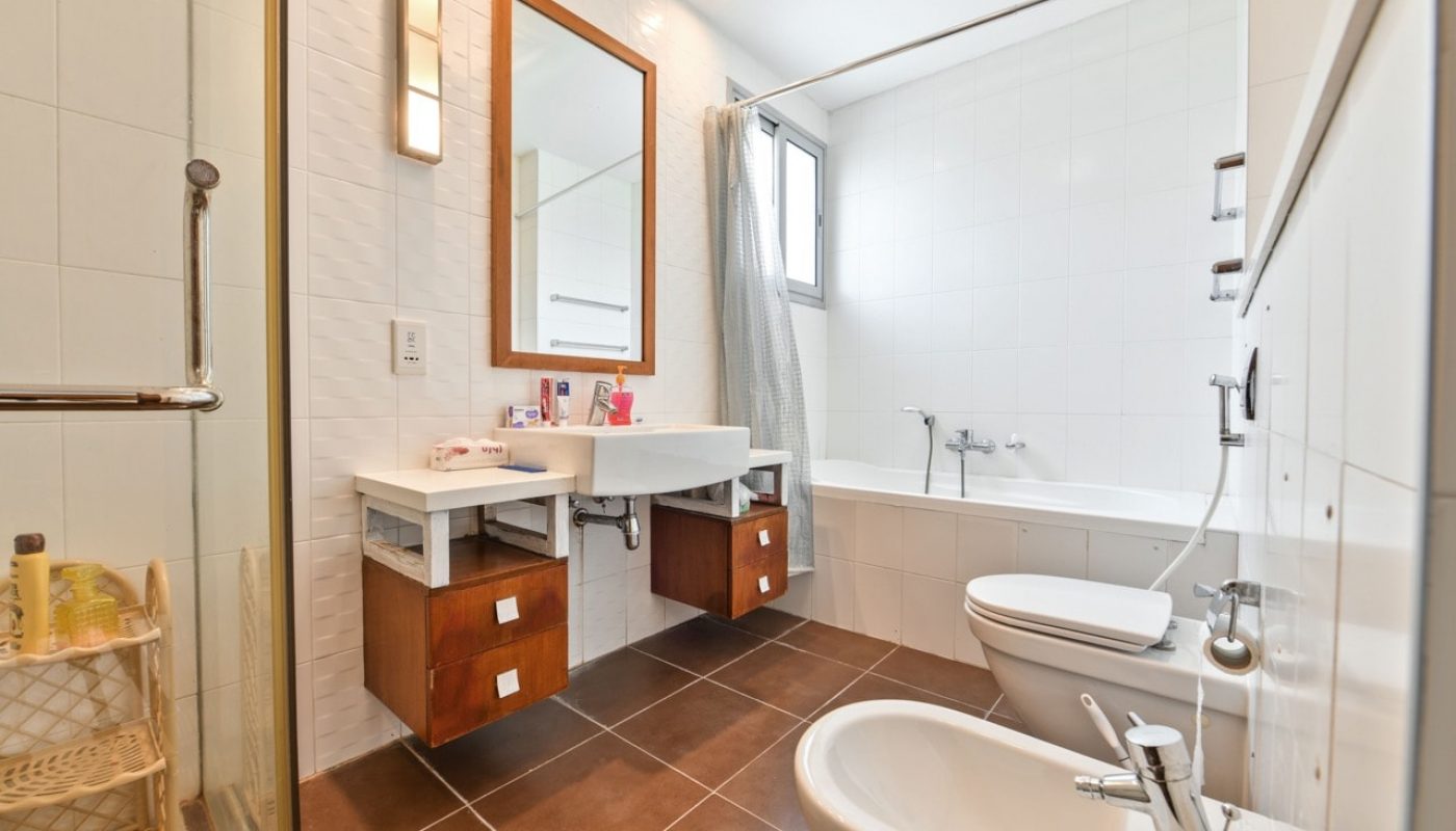 A luxurious bathroom with a sink, toilet and shower.