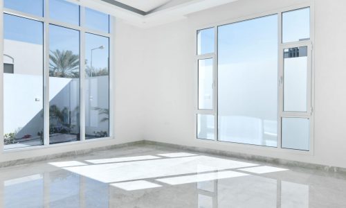 An Auto Draft room with large windows and a marble floor.