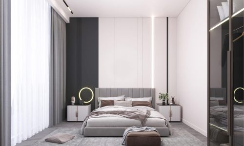 A modern bedroom featuring auto draft gray and white decor showcases a large bed, a ring lamp on the nightstand, and floor-to-ceiling curtains. A pouf and pillow are thoughtfully placed on the floor near the bed.