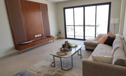 A living room with an exquisite couch and coffee table.