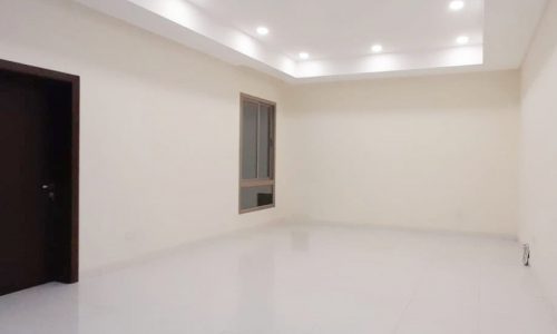 Brand New Luxury 3BR Villa for Sale in Aali, featuring an empty room with white tile floors and a door.