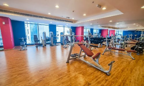 Fully furnished gym room with machines and weights for rent in Juffair.