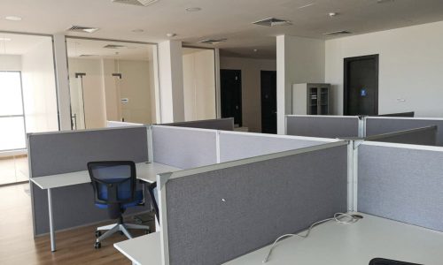 Empty office space with desks and cubicles available for rent in Saar, Bahrain.