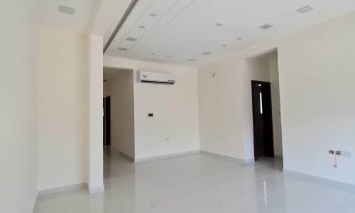 Neat office space with white tile floors and a ceiling fan available for rent in Seef.