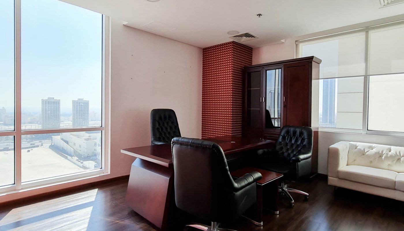 Attractive office space for rent in Bahrain's Seef area with large windows and a view of the city.