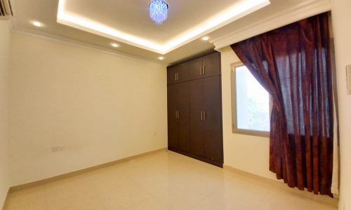 A stunning villa near Saar Mall with bright rooms adorned with ceiling fans and doors.