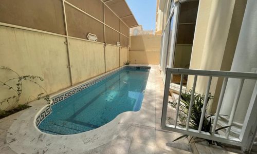 A luxurious villa in Al Mahooz with a swimming pool.